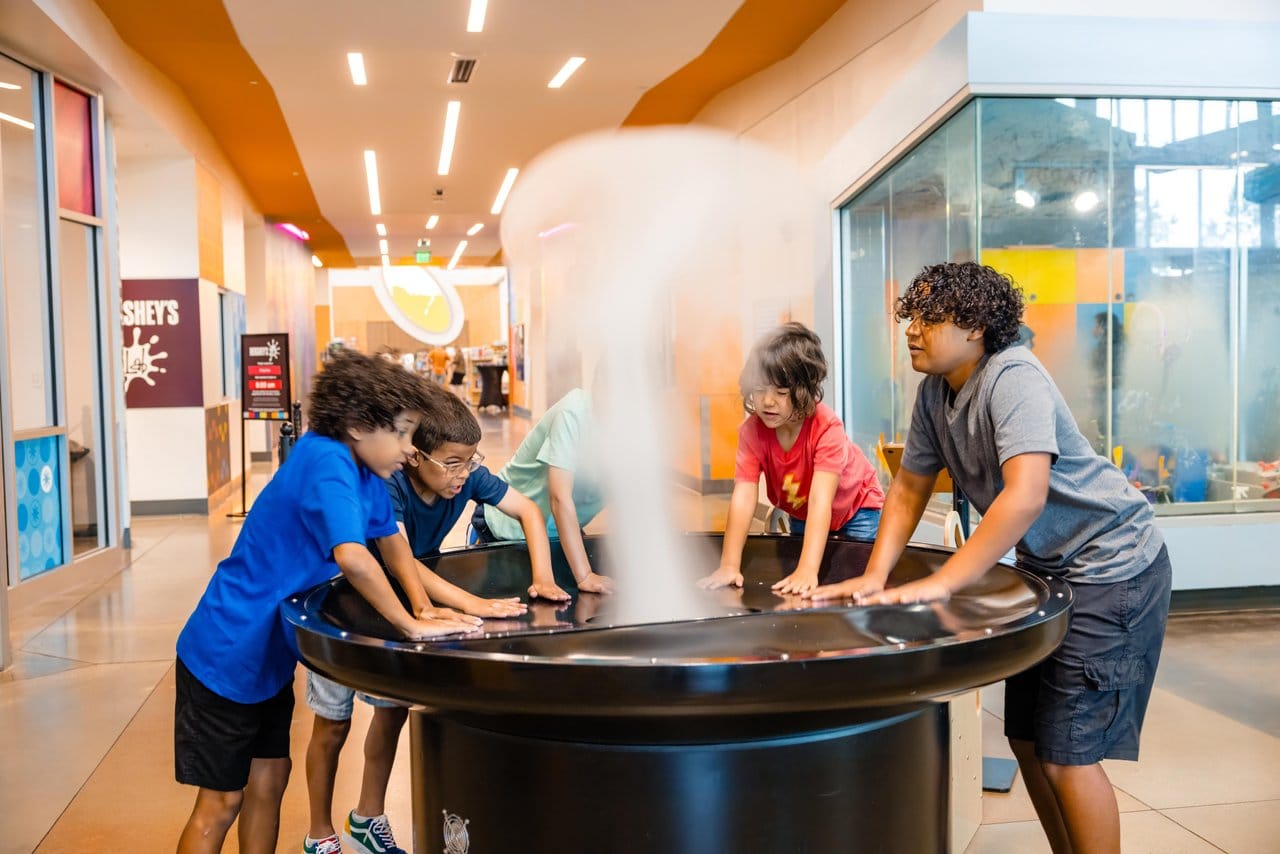 Kids playing with an interactive exhibit at Scott Family Amazeum
