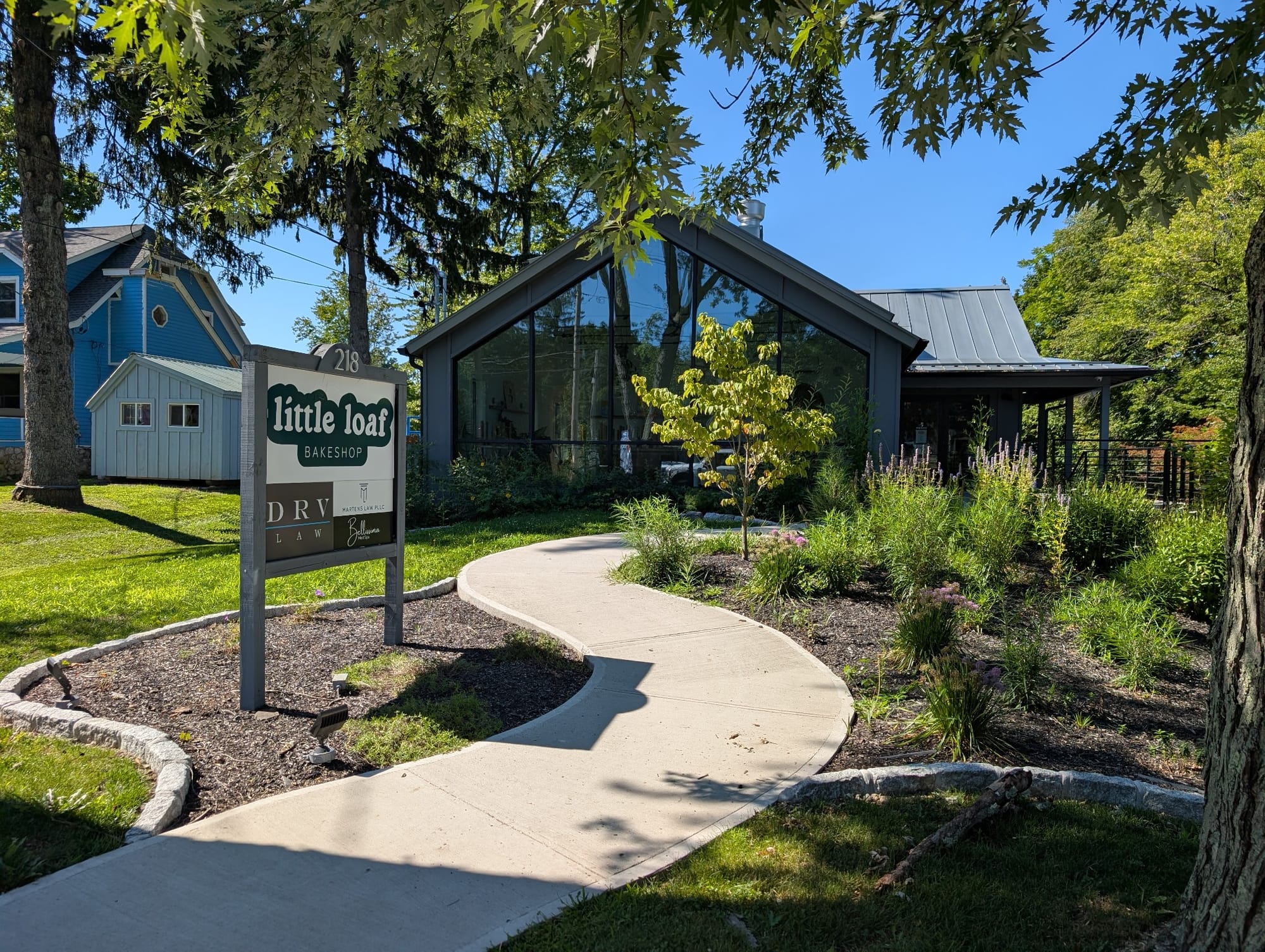 Paved trail entrance to Entrance at Little Loaf Bakeshop