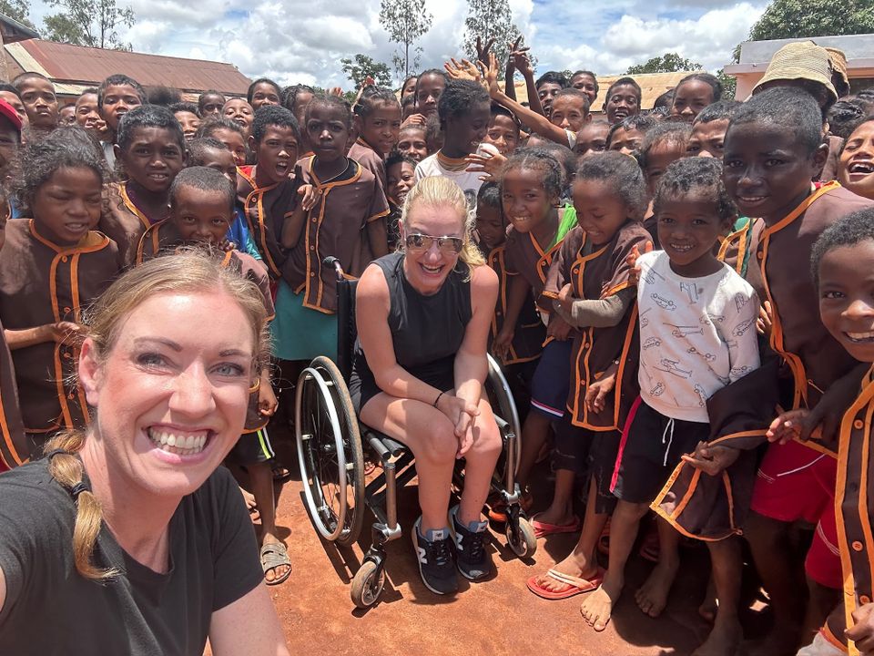 Wheelchair-user traveling in Madagascar, visiting a local school