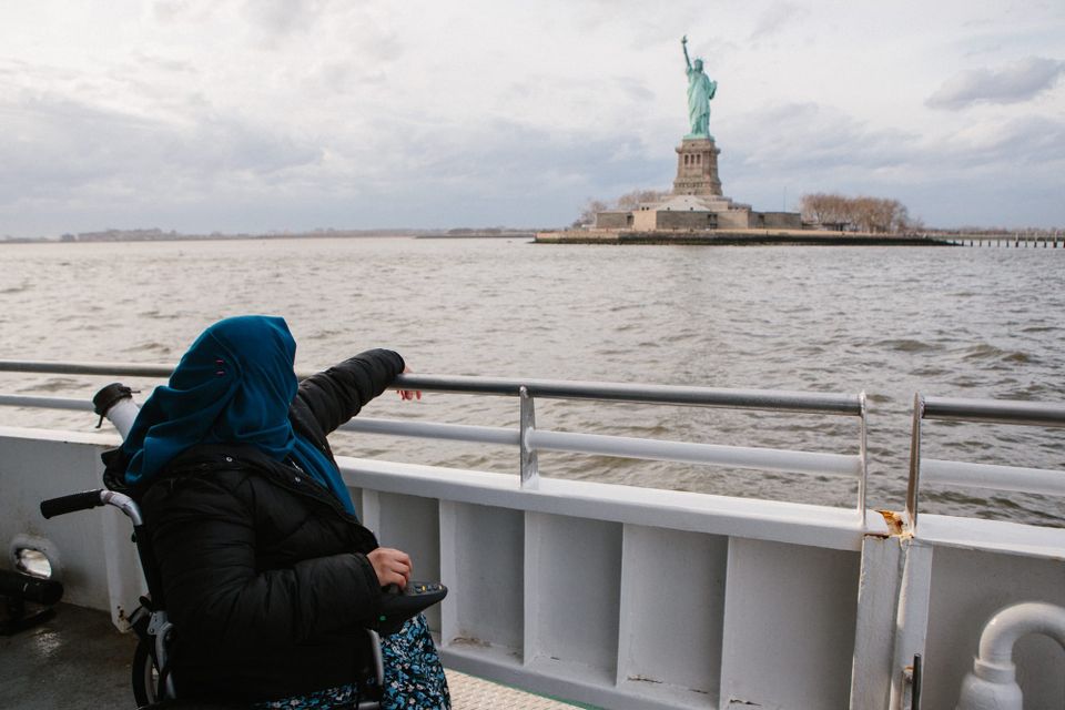 wheelchair-user enjoying views of the Statue of Liberty