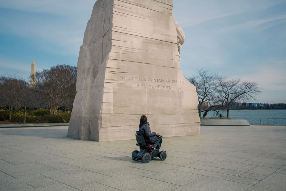 Wheelchair user visiting the MLK Jr. Memorial in Washington DC