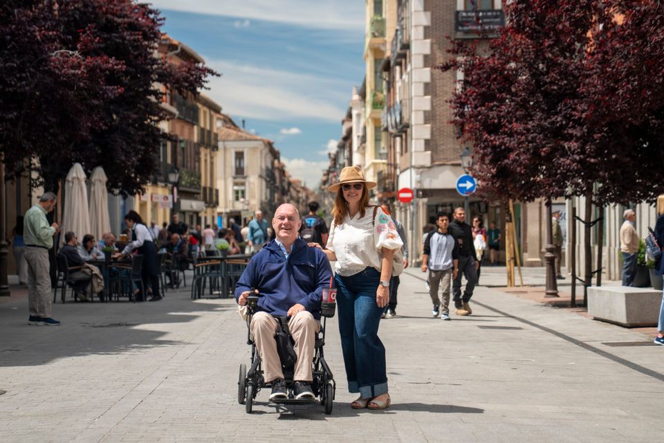 Bert, a wheelchair user, and his wife, Joy, traveling in Madrid