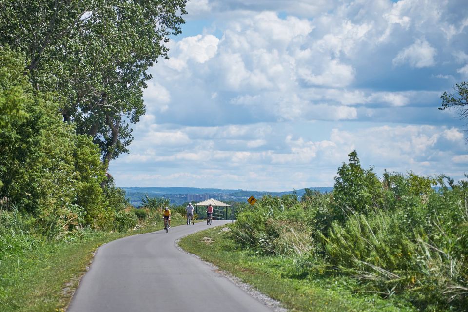 Bikers riding on path in Onondaga Lake Park in Syracuse