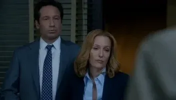 The main protagonists from The X-Files just shrugging.