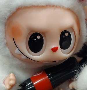 Close-up of a Labubu face.