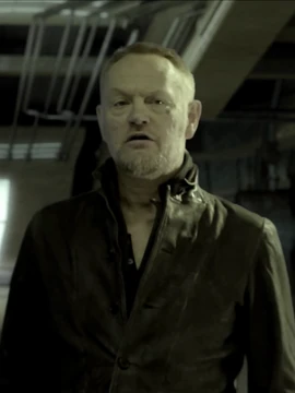 Anderson Dawes, a character in The Expanse. He appears to be in mid-conversation. The actor is Jared Harris-- who is also Hari Seldon in the Foundation series.
