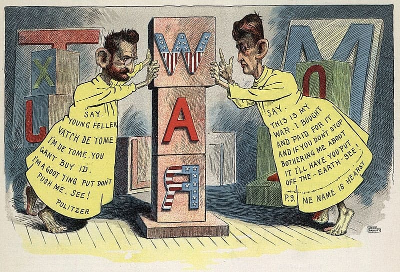William Hearst and Joseph Pulitzer dressed as Yellow Kid from the popular comic strip at the time. They are fighting over a stack of blocks that spell out war. 