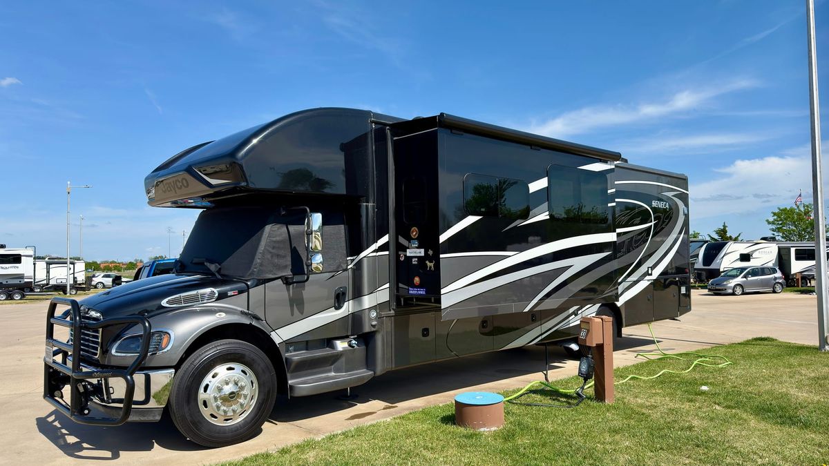 Harriet, a large Super C motorhome, parked at a paved RV site at Air Capital RV Park in Wichita, Kansas.