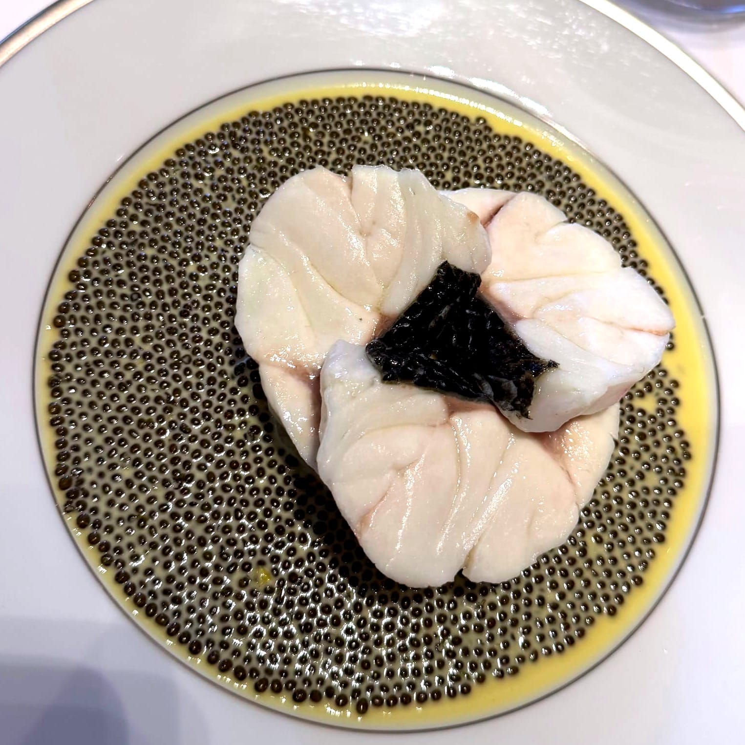 Line-caught sea bass with caviar at L’Ambroisie, presented in Shintaro Awa’s classical French style.