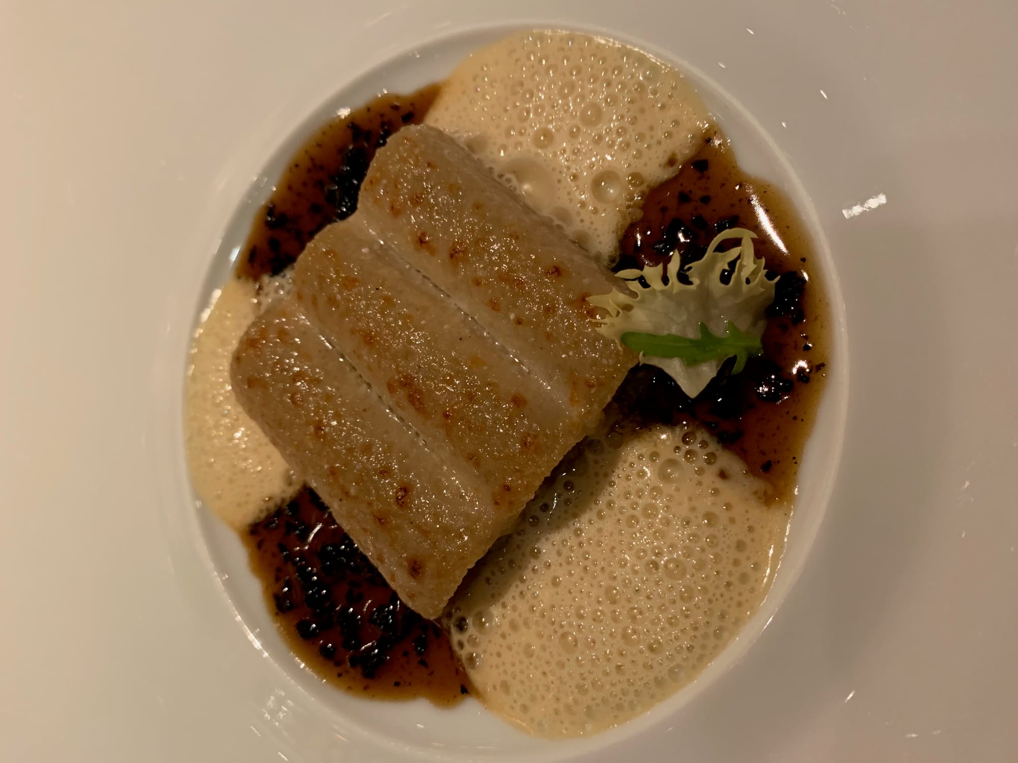 Foie-gras ravioli with black truffle — one of Éric Frechon’s longstanding Epicure classics.