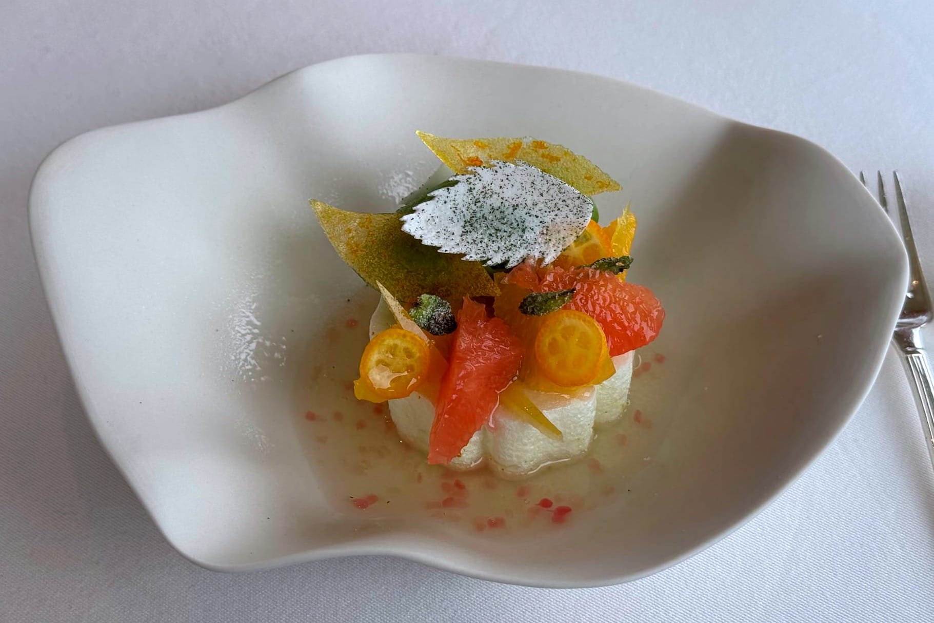 Citrus from the garden with spring herbs and meringue