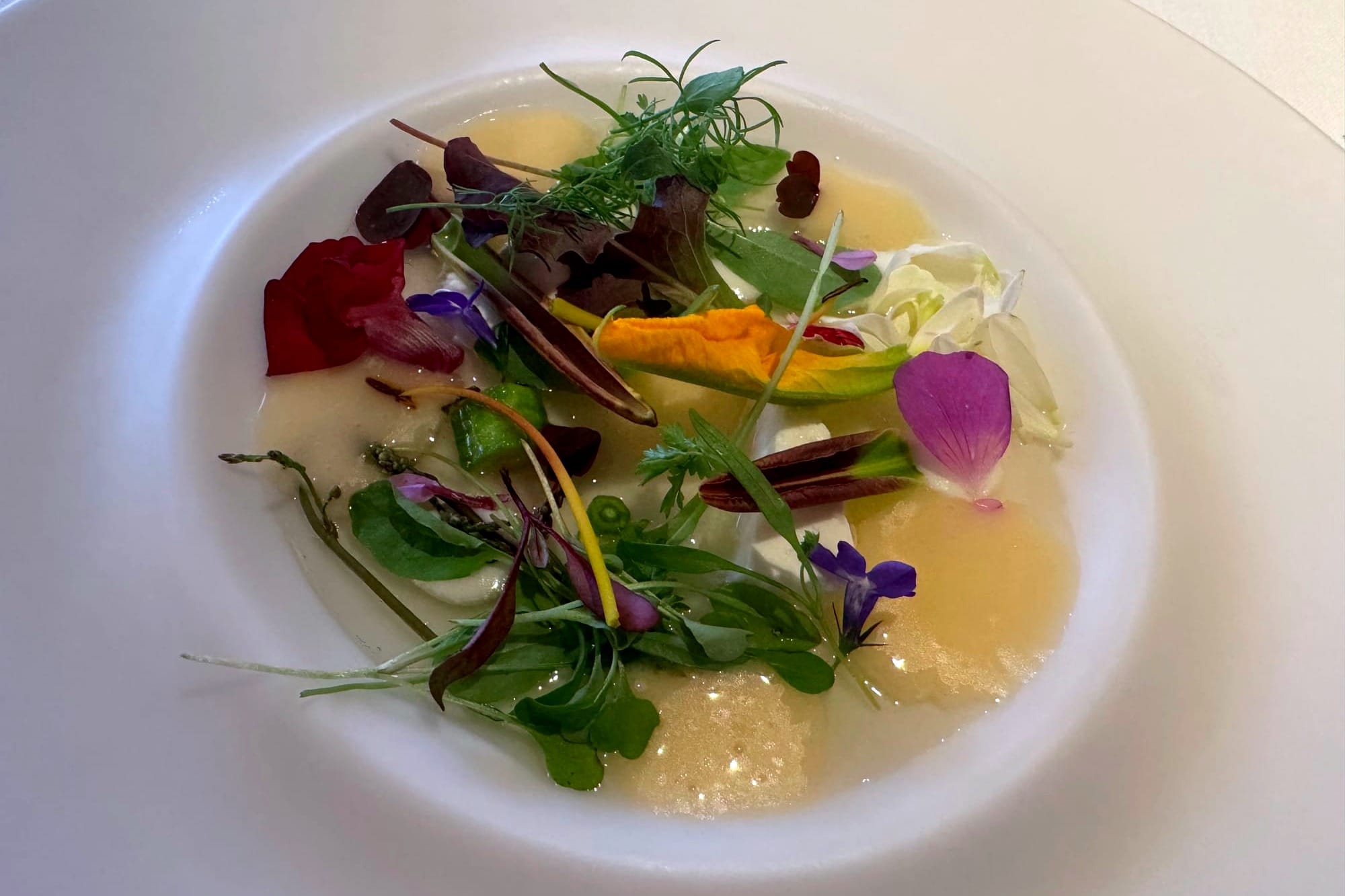 Leaves and shoots with curd cheese, mint, and tomato