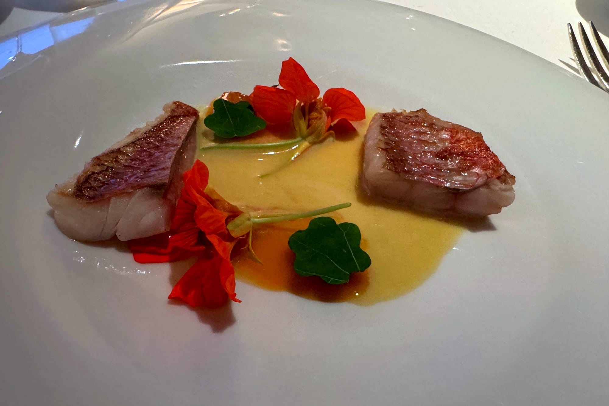 Steamed red mullet, nasturtium flower and roasted carrot at Casa Marcial