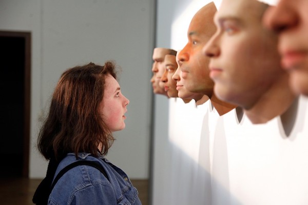 Visitor viewing Stranger Visions by Heather Dewey-Hagborg. Courtesy 3D Natives.