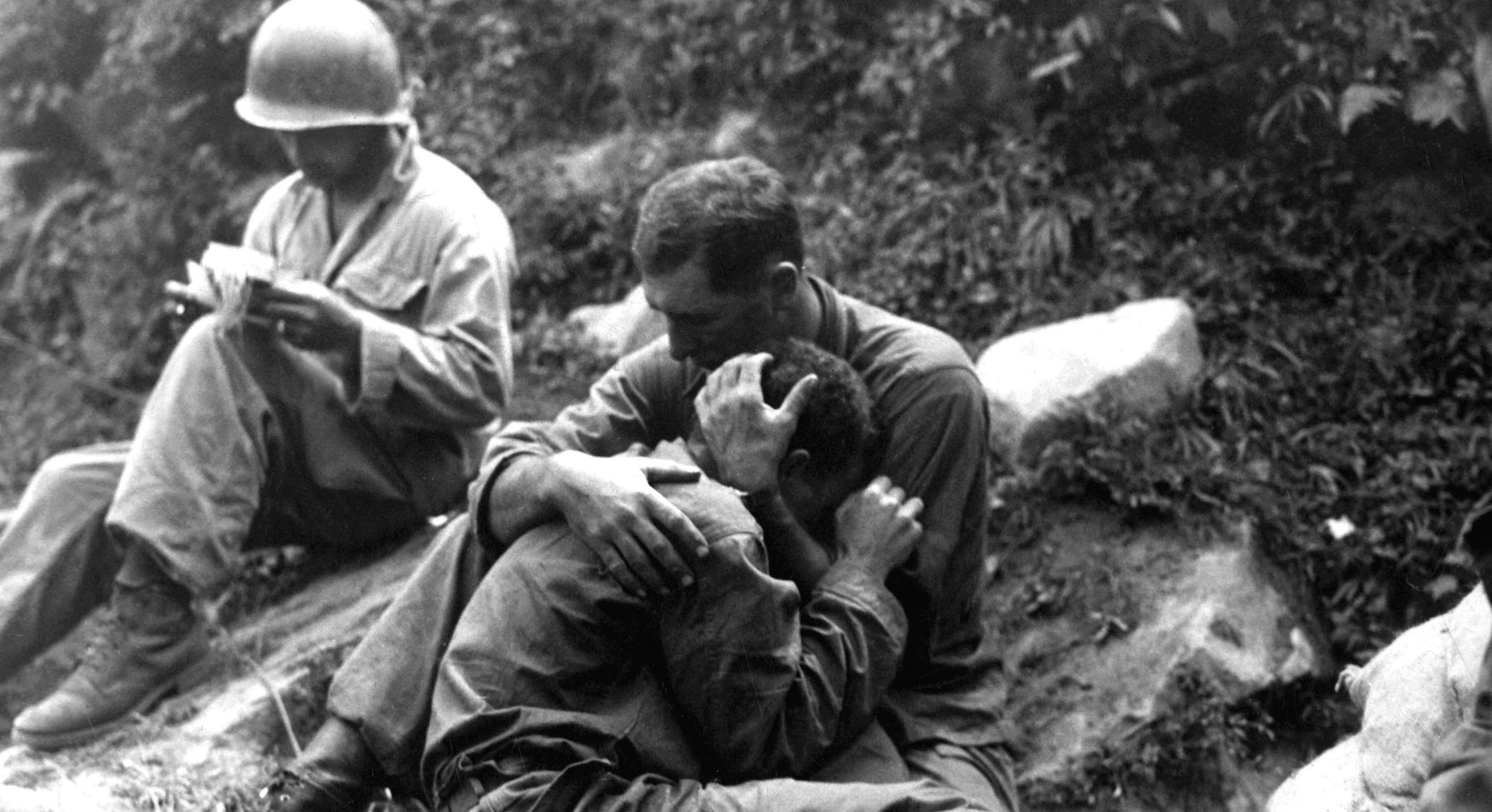 Soldiers comfort each other