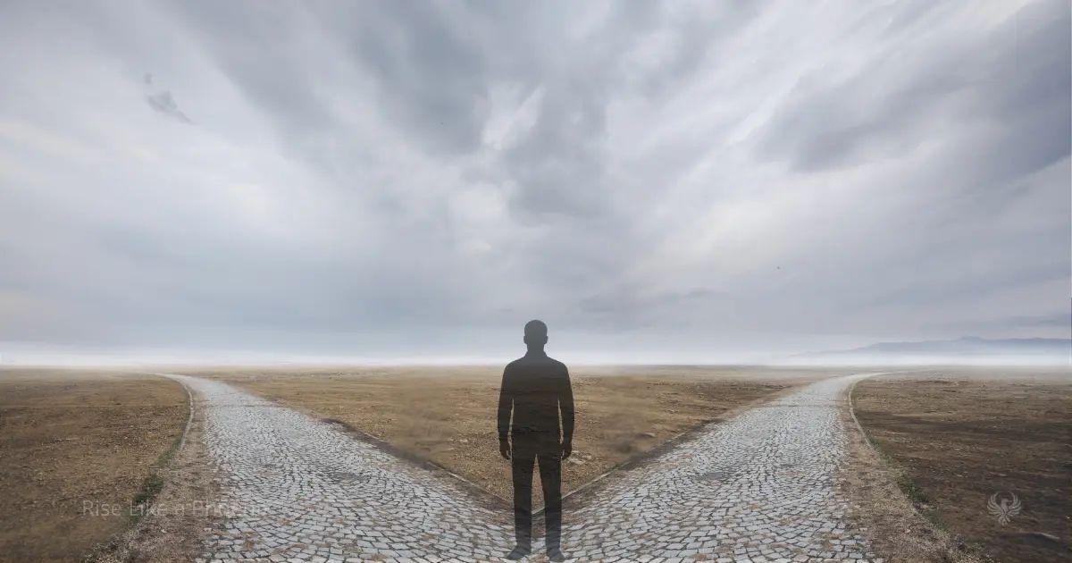 A person standing at a forked path under an open sky, symbolizing conscious choice and inner authority.