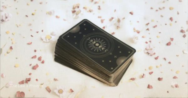 Closed Tarot deck on light fabric, symbolizing clarity and reflection rather than prediction.