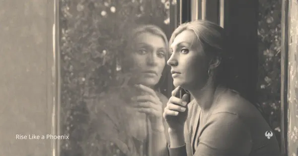A woman beside a window with her reflection, symbolizing attraction, attachment, love, projection, and inner discernment.