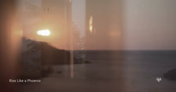 A warm sunset reflected through a window over the sea, symbolizing discernment, transition, and whether a karmic relationship should continue or end.