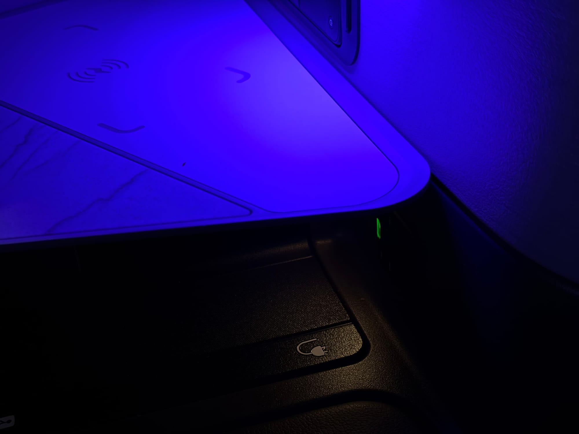 Blue ambient lighting across the United 787-9 Polaris cabin