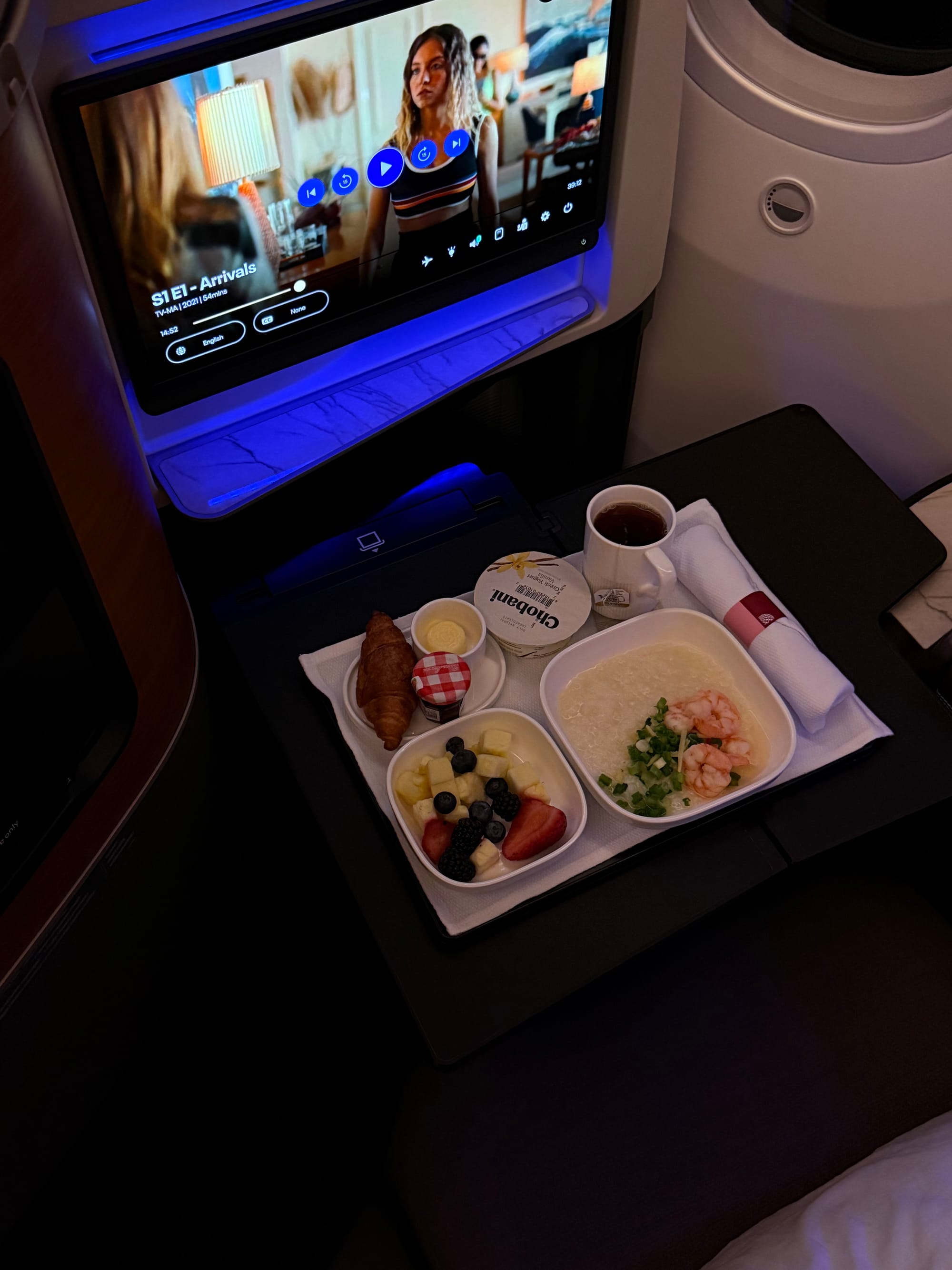 Polaris breakfast tray with croissant, fruit and yogurt before Singapore