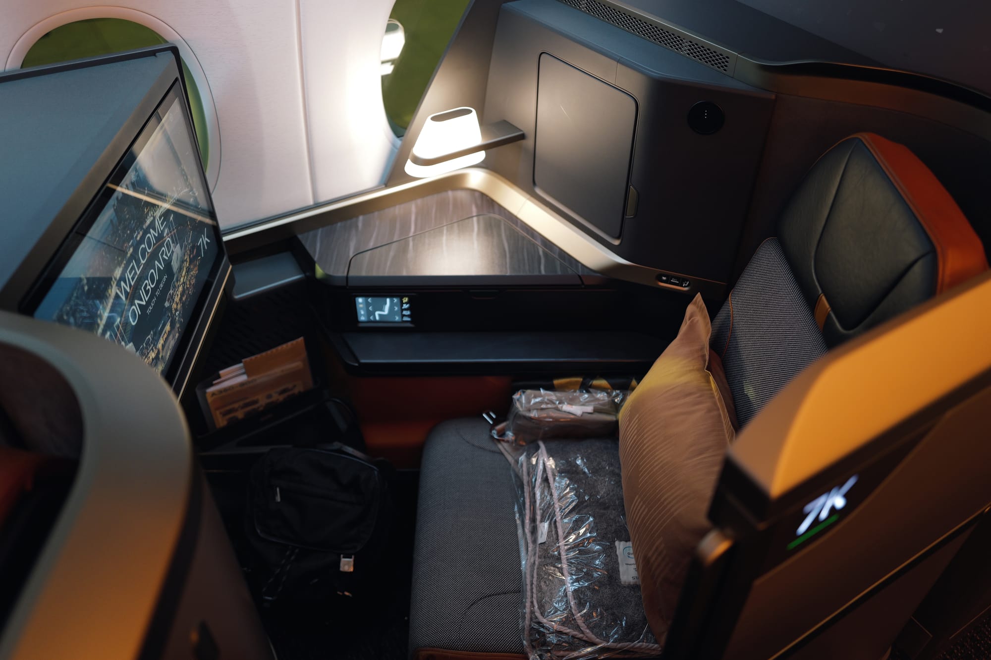STARLUX A350 business class Seat 7K with pillow, throw and wrapped headphones