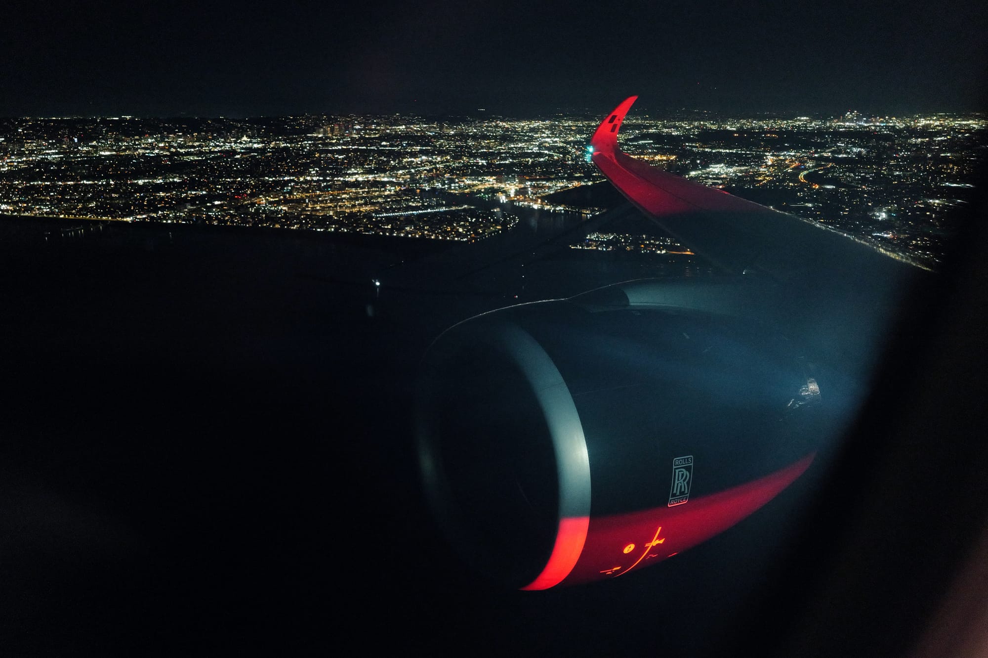City lights under the wing on descent into Taipei Taoyuan