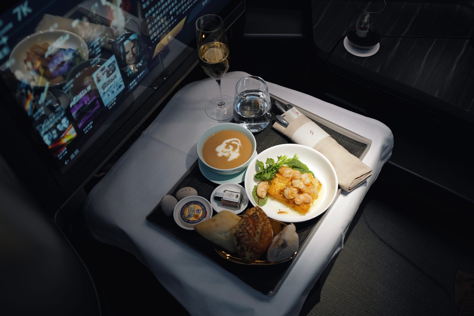 STARLUX A350-900 business class seat set for the dinner service on flight JX1, LAX to Taipei