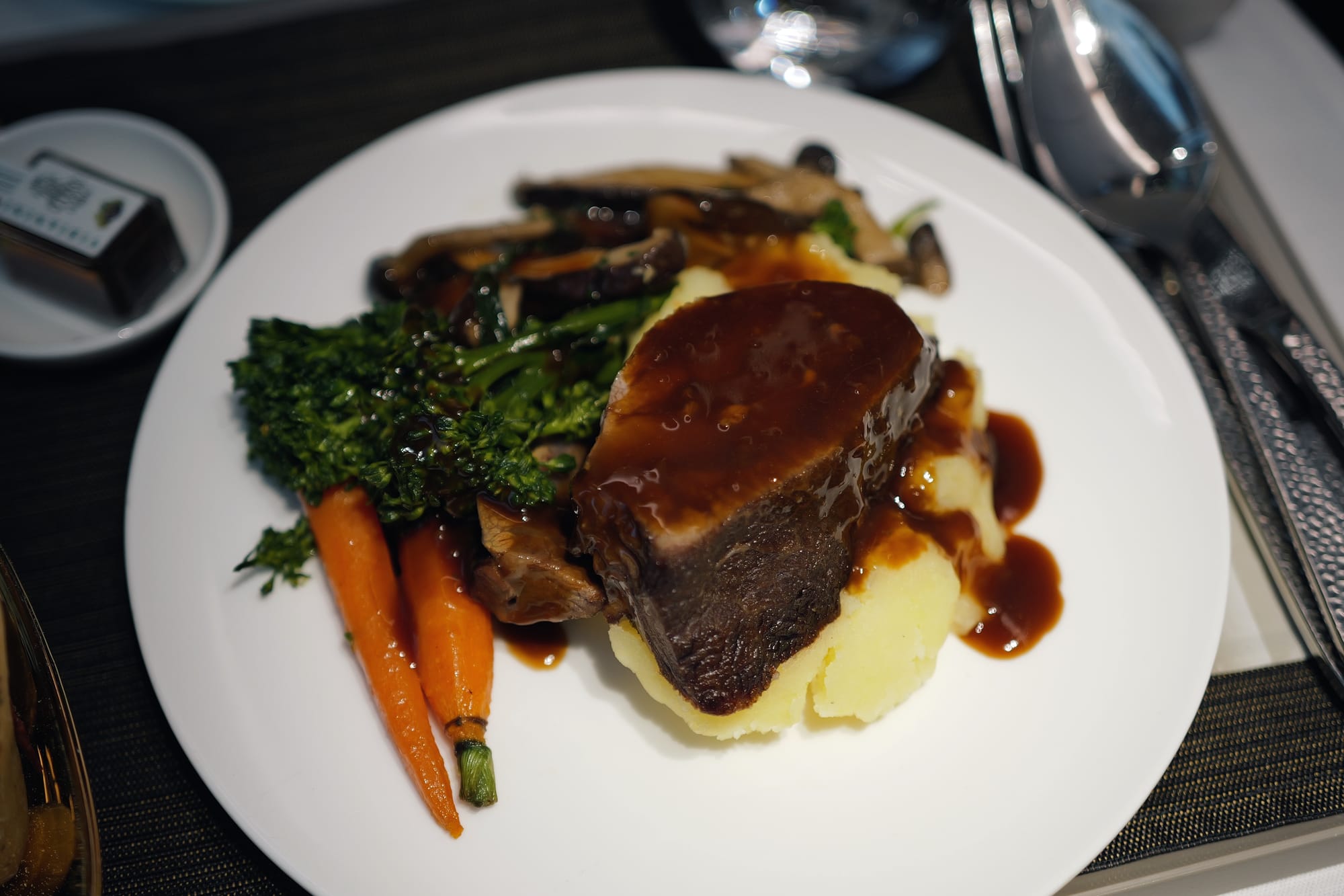 STARLUX A350 business class main course of braised beef cheek over mash