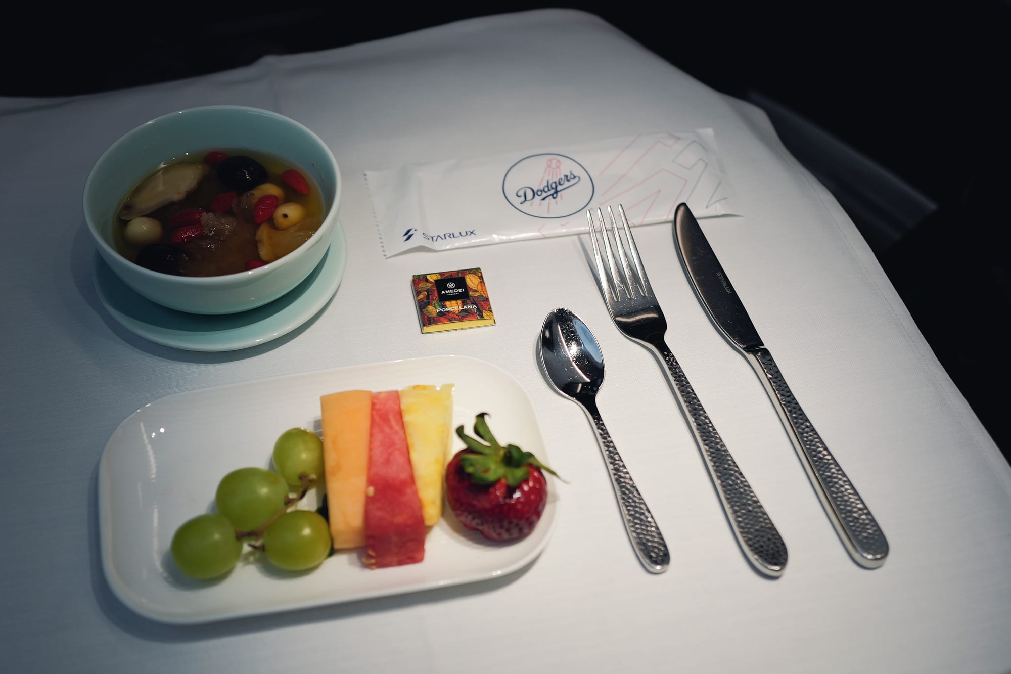 STARLUX business class first meal service with appetiser, fruit and dessert, LAX to Taipei