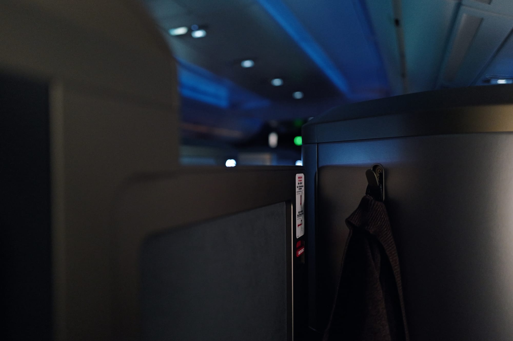 Darkened STARLUX A350 business class cabin at night over the Pacific