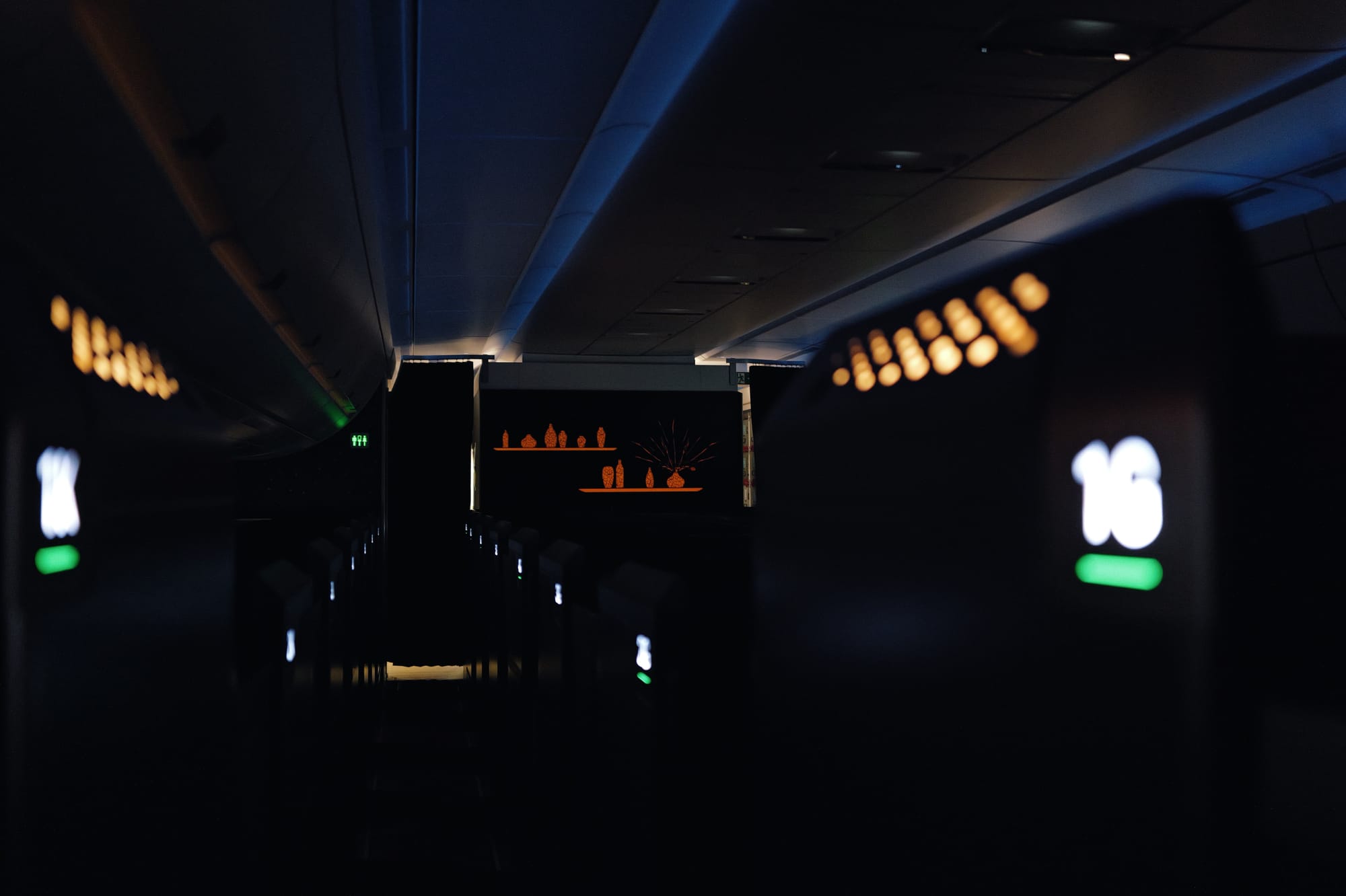 STARLUX A350 business class cabin aisle glowing in the dark