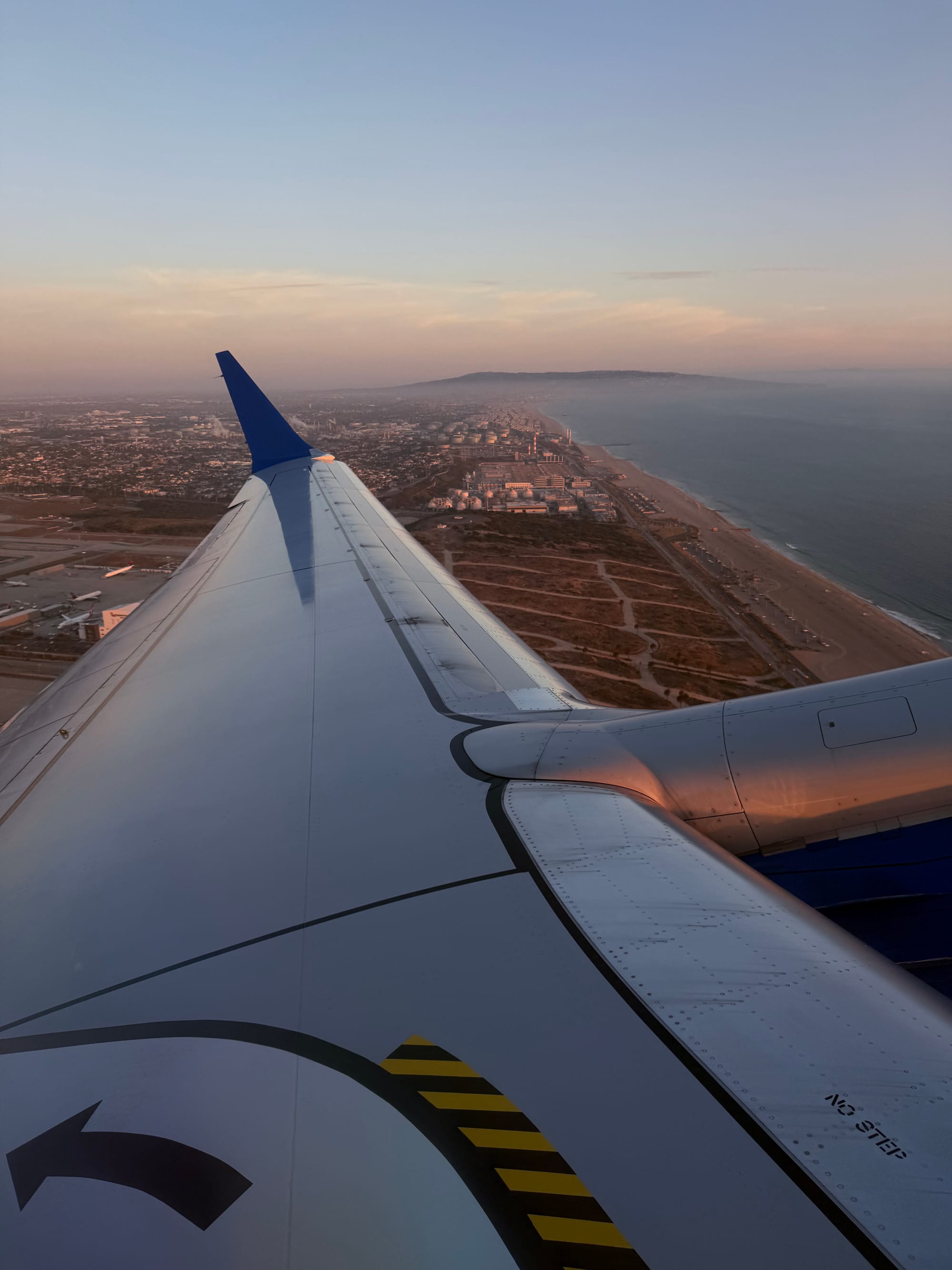 Wing view at sunset between Los Angeles and San Francisco