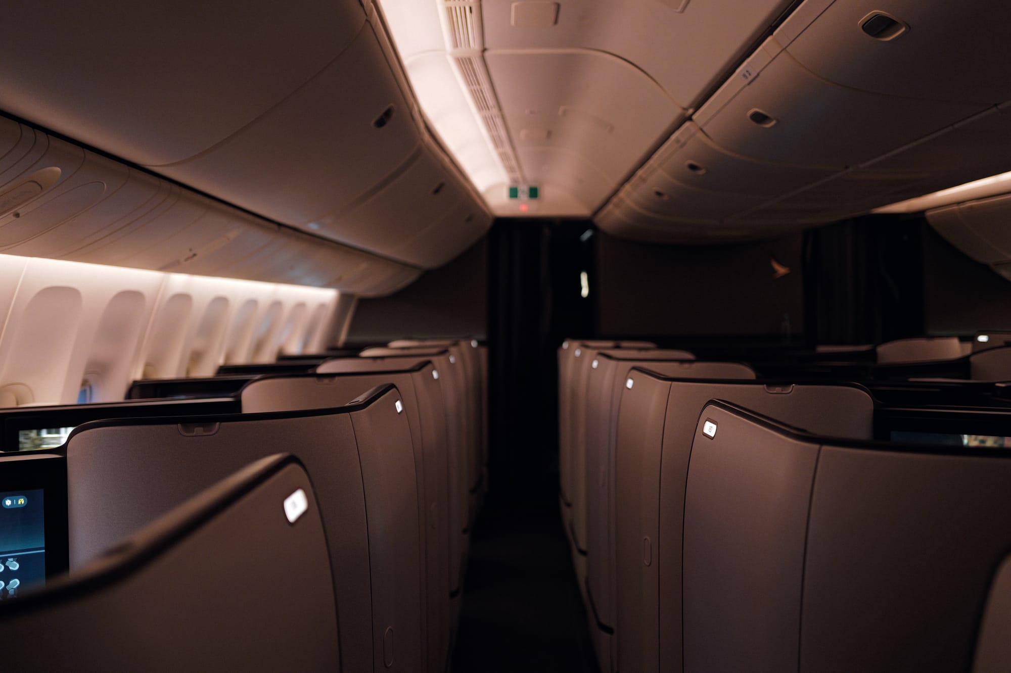 777-300ER business class aisle in morning light
