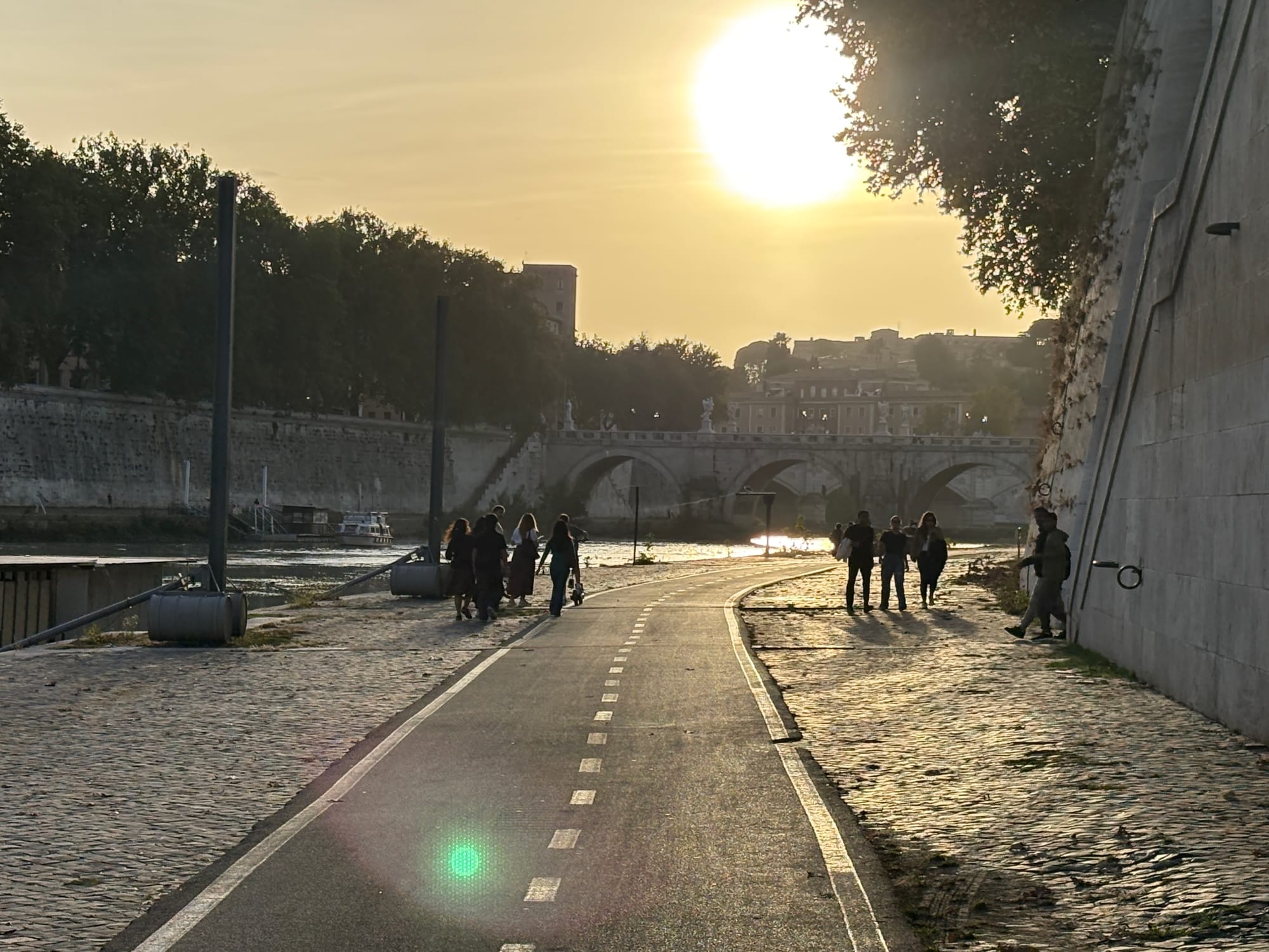 The sun setting above the Tiber in Rome