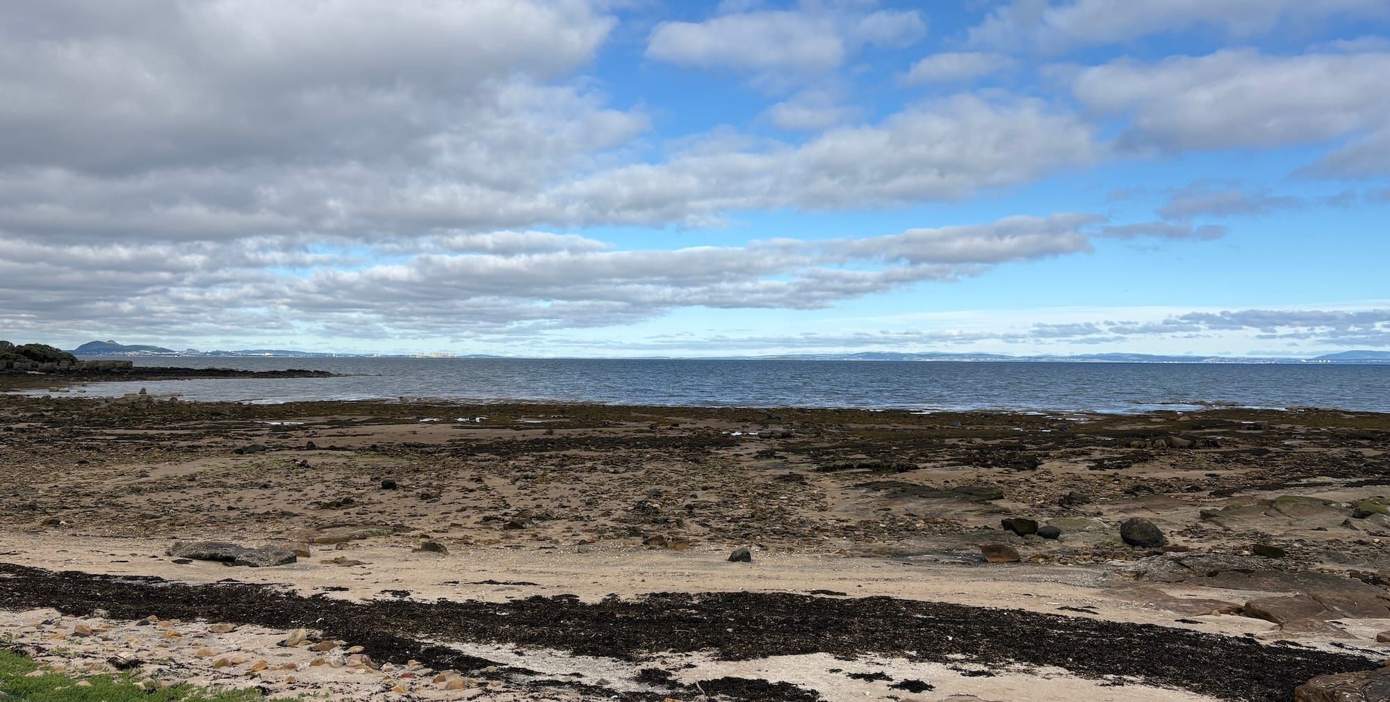 Beach, clouds, sand and rocks