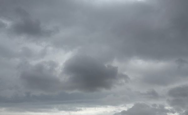 A grey sky with clouds