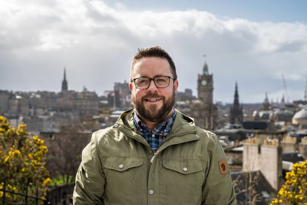 Me, standing in front of the Edinburgh skyline