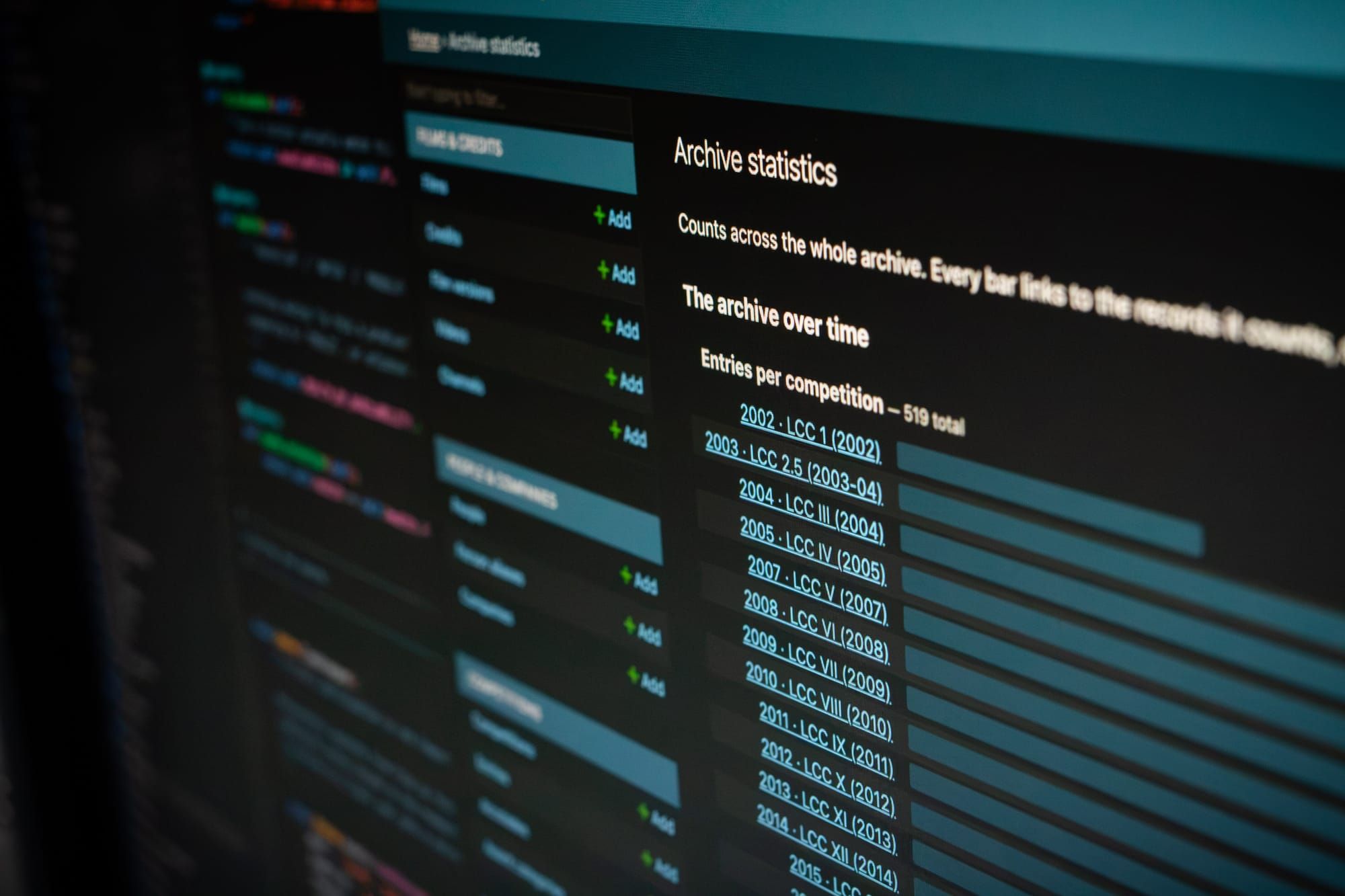 Close-up image of monitor displaying bar graphs from the back end of the new SaberComp archive.