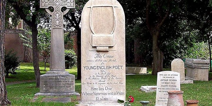 Keats's gravestone in the Protestant Cemetery, Rome, naming hims as a "Young English Poet. "carved with a lyre and the epitaph 'Here lies One Whose Name was writ in Water.'