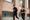 Man and woman running together looking at each other