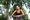 A woman runner stops because of a side stitch