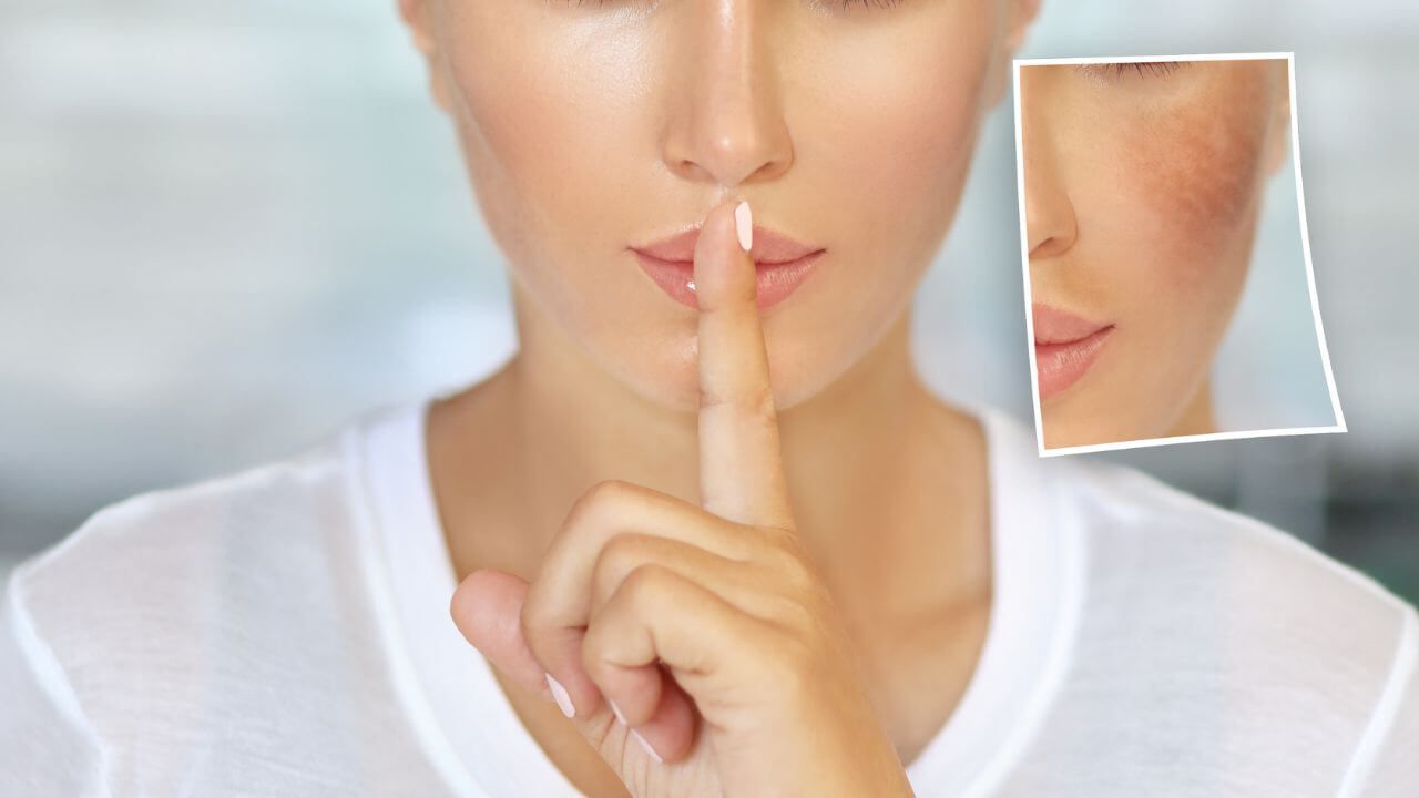 Woman gesturing with her finger to be quite about her smoother skin after using the best body wash to remove dark spots.