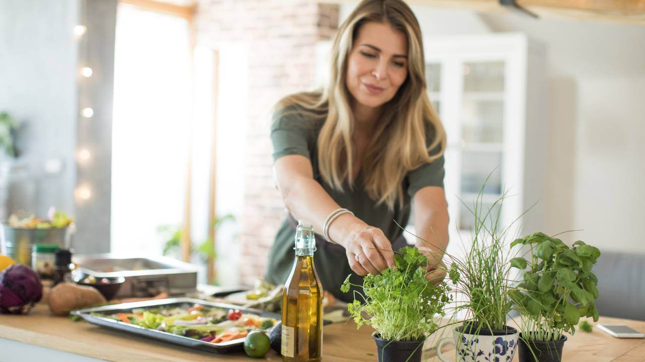 A woman preparing a plant-based meal.