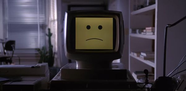 In the movie "Electric Dreams", a desktop computer displays a sad face.