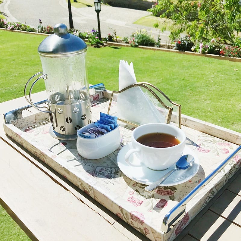 A cup of weak coffee in the garden, Nuwara Eliya