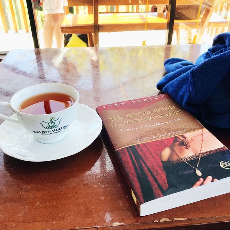 Having tea with a good book in the hills of Ella, Sri Lanka