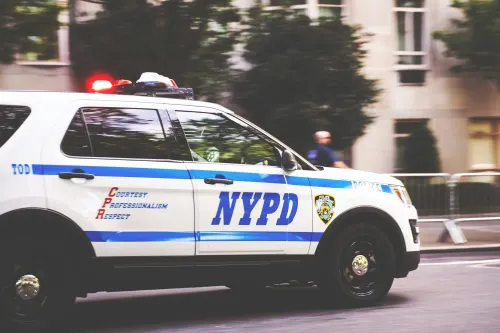 An NYPD patrol vehicle moving through a New York street.