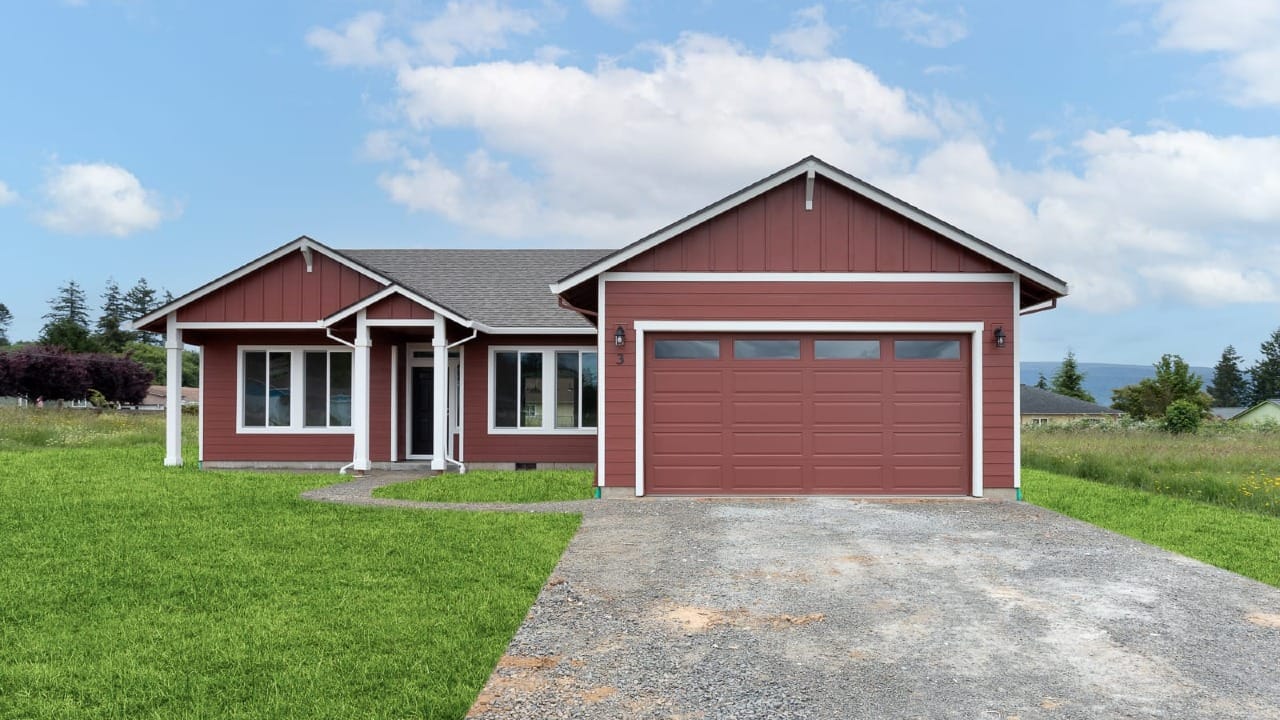 A house surrounded by green grass painted with red paint