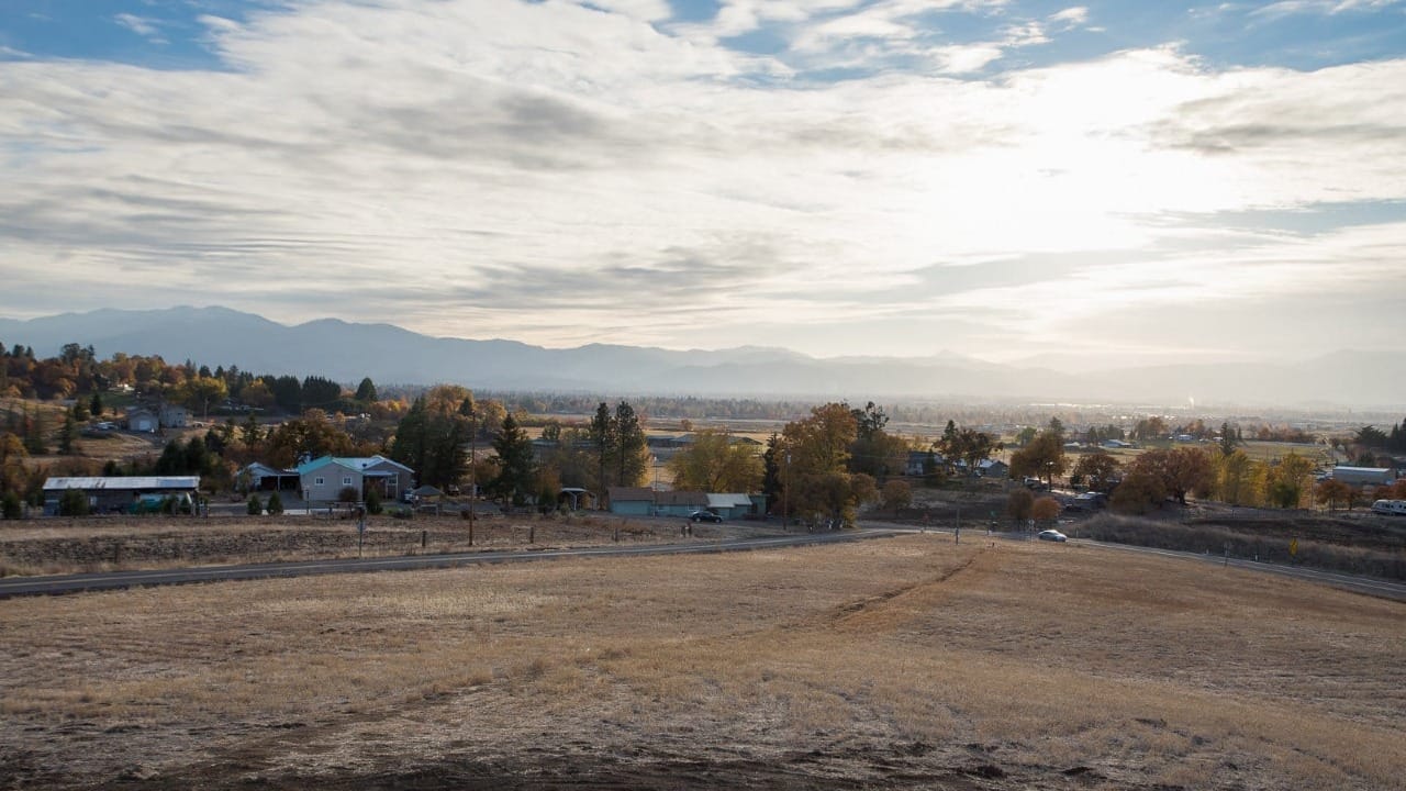 A field with a bunch of houses around